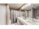Bright bathroom features double sinks, granite counters, framed mirror and shower over tub combo at 4931 Wilkins Station Dr, Decatur, GA 30035