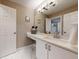 Bright bathroom with a large mirror, extended countertop, and white marble floors at 4931 Wilkins Station Dr, Decatur, GA 30035