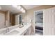 Bathroom boasts double sinks with granite counters, framed mirror and views of bedroom at 4931 Wilkins Station Dr, Decatur, GA 30035