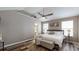 Spacious bedroom featuring a ceiling fan, vaulted ceiling, a window, and a comfortable bed with white linens at 4931 Wilkins Station Dr, Decatur, GA 30035