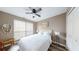 Bright bedroom featuring a ceiling fan, neutral walls, a window, and a bed with crisp white bedding at 4931 Wilkins Station Dr, Decatur, GA 30035