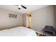 Neutral bedroom features a ceiling fan, wall decor, and hardwood flooring at 4931 Wilkins Station Dr, Decatur, GA 30035
