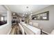 Stylish dining area with a rustic table, modern chandelier, and hardwood flooring at 4931 Wilkins Station Dr, Decatur, GA 30035
