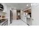 Modern kitchen with stainless steel appliances, marble floors, and bright lighting at 4931 Wilkins Station Dr, Decatur, GA 30035