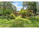 Secluded backyard with mature trees and lush landscaping at 5400 Francis Ave, Stone Mountain, GA 30087