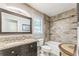 Bathroom with granite counters, tile shower, and framed mirror at 5400 Francis Ave, Stone Mountain, GA 30087