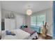 Bedroom with hardwood floors, lots of natural light, and fun accessories at 5400 Francis Ave, Stone Mountain, GA 30087
