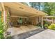 Attached carport with brick columns and light green doors at 5400 Francis Ave, Stone Mountain, GA 30087