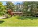 Lovely home with a lush green lawn and colorful landscaping, offering a welcoming outdoor space at 5400 Francis Ave, Stone Mountain, GA 30087