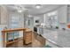 Modern kitchen with white cabinets, granite countertops, stainless steel appliances and open shelving at 5400 Francis Ave, Stone Mountain, GA 30087