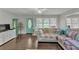 Cozy living room with a turquoise door, plush seating, and hardwood floors at 5400 Francis Ave, Stone Mountain, GA 30087