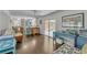 Open living space featuring hardwood floors and sliding glass doors at 5400 Francis Ave, Stone Mountain, GA 30087