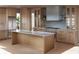 Open kitchen design with island, stainless steel appliances, light wood cabinets, and modern countertops at 125 Spring Dr, Roswell, GA 30075
