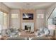 Bright living room with fireplace, mantle, modern lighting, and neutral decor at 125 Spring Dr, Roswell, GA 30075
