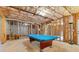 Unfinished basement with insulation and a pool table for entertainment at 5003 Pacific Dunes Dr, Suwanee, GA 30024
