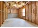 Unfinished basement with framed walls and insulation visible at 5003 Pacific Dunes Dr, Suwanee, GA 30024