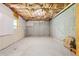 Unfinished basement with concrete floor and exposed ceiling insulation at 5003 Pacific Dunes Dr, Suwanee, GA 30024