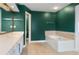 Bathroom with a vanity, soaking tub and tile floor at 5003 Pacific Dunes Dr, Suwanee, GA 30024