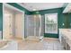 Bright bathroom with a glass enclosed shower, soaking tub and vanity at 5003 Pacific Dunes Dr, Suwanee, GA 30024