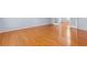 Spacious bedroom featuring hardwood floors, neutral paint, and French doors at 5003 Pacific Dunes Dr, Suwanee, GA 30024