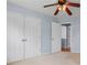 Bedroom featuring carpet floors, ceiling fan, and closet at 5003 Pacific Dunes Dr, Suwanee, GA 30024