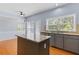 Kitchen area with a view to the dining area, featuring a granite countertop and sink at 5003 Pacific Dunes Dr, Suwanee, GA 30024