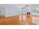 Spacious living room featuring hardwood floors, a fireplace, and vaulted ceilings at 5003 Pacific Dunes Dr, Suwanee, GA 30024