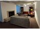 Cozy basement living area features a stone fireplace, bookshelves, and comfortable seating at 1620 Stonecliff Dr, Decatur, GA 30033