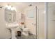 Well-lit bathroom featuring a pedestal sink and walk-in shower at 1620 Stonecliff Dr, Decatur, GA 30033