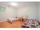 Cozy bedroom with hardwood floors and matching bedside lamps at 1620 Stonecliff Dr, Decatur, GA 30033
