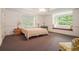 Relaxing bedroom featuring a window seat and ample natural light at 1620 Stonecliff Dr, Decatur, GA 30033