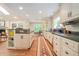 Spacious kitchen with white cabinetry, hardwood floors, and an open layout at 1620 Stonecliff Dr, Decatur, GA 30033
