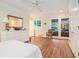 Spacious primary bedroom features hardwood floors, white furniture, and balcony access at 1620 Stonecliff Dr, Decatur, GA 30033