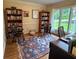 Bright office with bookshelves, hardwood floors, and a large window view at 1620 Stonecliff Dr, Decatur, GA 30033
