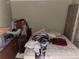 Cluttered bedroom includes a mattress, nightstand, clothing and boxes at 195 Darla Dr, Woodstock, GA 30188