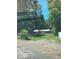 Exterior view of the property from the road, showing the home and outbuilding at 195 Darla Dr, Woodstock, GA 30188