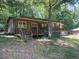 Cabin-style home featuring a covered porch with seating area at 195 Darla Dr, Woodstock, GA 30188