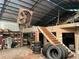 Wide garage interior showing a storage loft, shelves, and stacked tires, highlighting potential for versatile usage at 195 Darla Dr, Woodstock, GA 30188