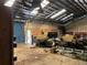 View of garage showcasing ample storage, equipment, and workspace, making it an ideal space for hobbies or professional use at 195 Darla Dr, Woodstock, GA 30188