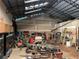 View of the interior of the outbuilding with machinery, tools, and storage at 195 Darla Dr, Woodstock, GA 30188