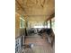 Spacious covered porch filled with furniture and belongings at 195 Darla Dr, Woodstock, GA 30188