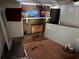 Bare room showing a fireplace with paintings and a covered up hole in the wall at 195 Darla Dr, Woodstock, GA 30188