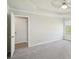Bedroom with a fan, plush carpet flooring, and an open door at 2268 Orleans Ave, Marietta, GA 30062