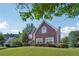 Charming brick two-story home with a well-kept lawn and mature trees at 2268 Orleans Ave, Marietta, GA 30062