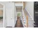 Bright foyer featuring hardwood floors, a staircase with white railings, and neutral wall paint at 2268 Orleans Ave, Marietta, GA 30062