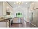 Bright kitchen with stainless steel appliances, custom cabinets and large view windows at 2268 Orleans Ave, Marietta, GA 30062