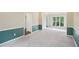 Bright living room with carpet flooring, chair rail and open doorway at 2268 Orleans Ave, Marietta, GA 30062