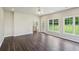 Bright living room with hardwood floors, big windows, and access to the kitchen at 2268 Orleans Ave, Marietta, GA 30062