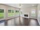 Spacious living room with hardwood floors, a fireplace, large windows overlooking the backyard at 2268 Orleans Ave, Marietta, GA 30062