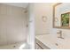 Modern bathroom featuring tiled shower, vanity with sink, and stylish fixtures at 3031 Walker Dr, Marietta, GA 30062